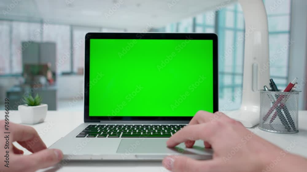 Businessman working on laptop with green screen in Office. Advertising area, workspace mock up. Businessman working on laptop with green screen in Office. Advertising area, workspace mock up.