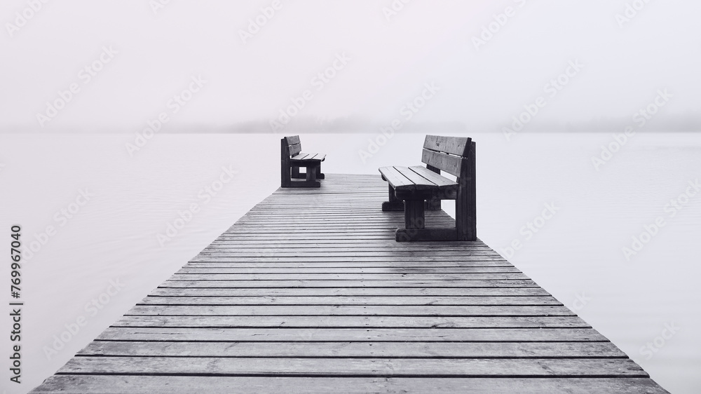 Two benches opposite each other on the pier and fog on the lake. - obrazy, fototapety, plakaty 