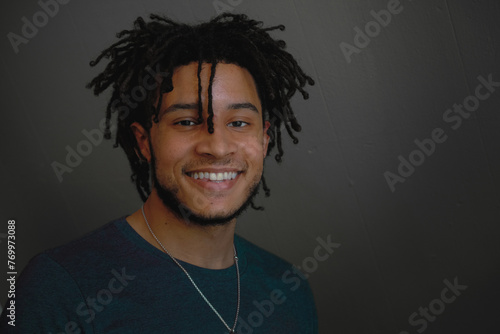 Indoor portrait of young handsome African-American man smiling © Lana