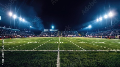 Amidst the night sky, the American football stadium radiates with energy, igniting passion and excitement in fans.