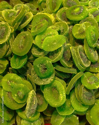 Slices of kiwi, each exhibiting a bright green color.