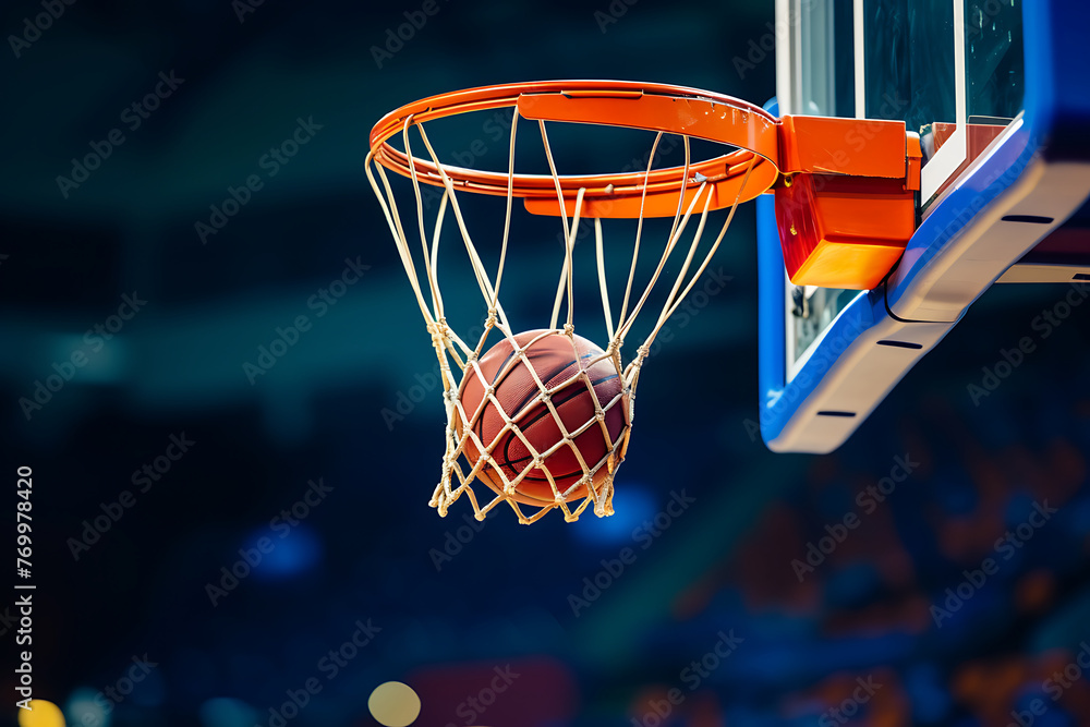 Close-up of a basketball swishing through the net, capturing the decisive moment in a dynamic game