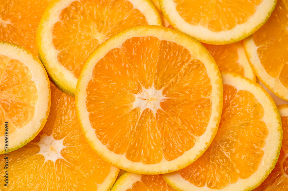 Closeup of sliced juicy oranges textured background Closeup of sliced juicy oranges textured background