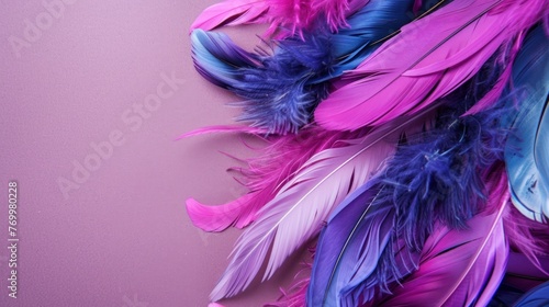 purple feathers on a purple background copy space
