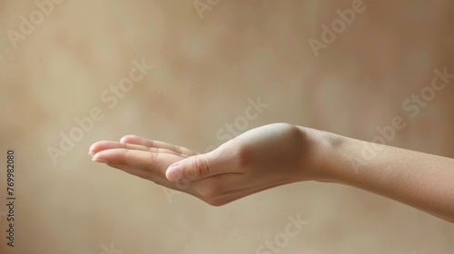 In Hand. Beauty Female Hand Gesture Holding Skincare Products photo