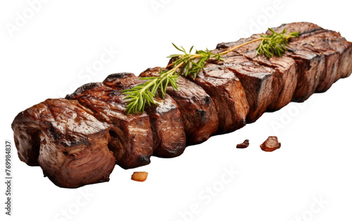 A juicy piece of steak adorned with a fresh sprig of rosemary