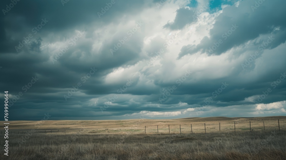Threatening storm clouds gathering over plains - Vast plains under the threat of dark, heavy storm clouds, symbolizing nature's unpredictable fury