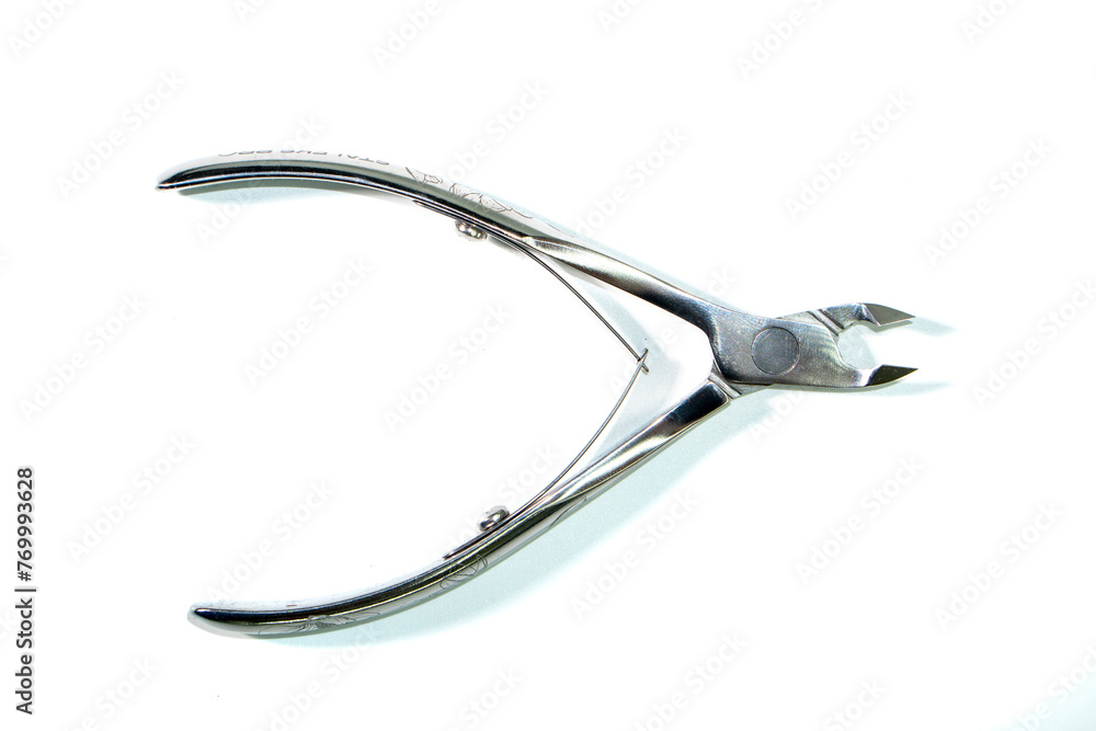 Nail art tools.nail clippers on a white background. manicure. pedicure.beauty concept Nail art tools.nail clippers on a white background. manicure. pedicure.beauty concept