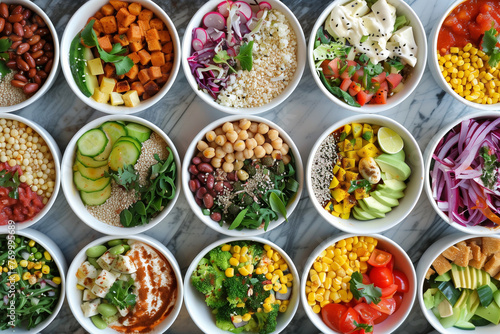 A row of bowls filled with various types of food  including salads and vegetables. The bowls are arranged in a way that creates a sense of abundance and variety