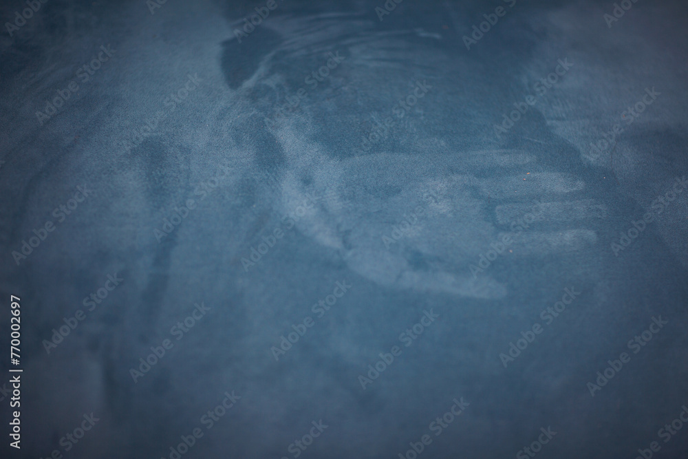 Mark of the hand on the blue velour textured surface. Palm silhouette. Concept of ghostly vision, phantom. handprint on fabric. - obrazy, fototapety, plakaty 