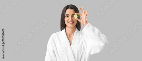 Young woman with cucumber s...