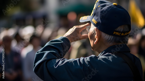 veteran salutes while crowd looks on on east walter hill photo