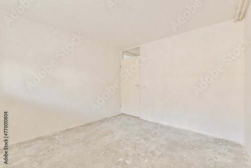 Empty room ready for renovation with textured floor photo