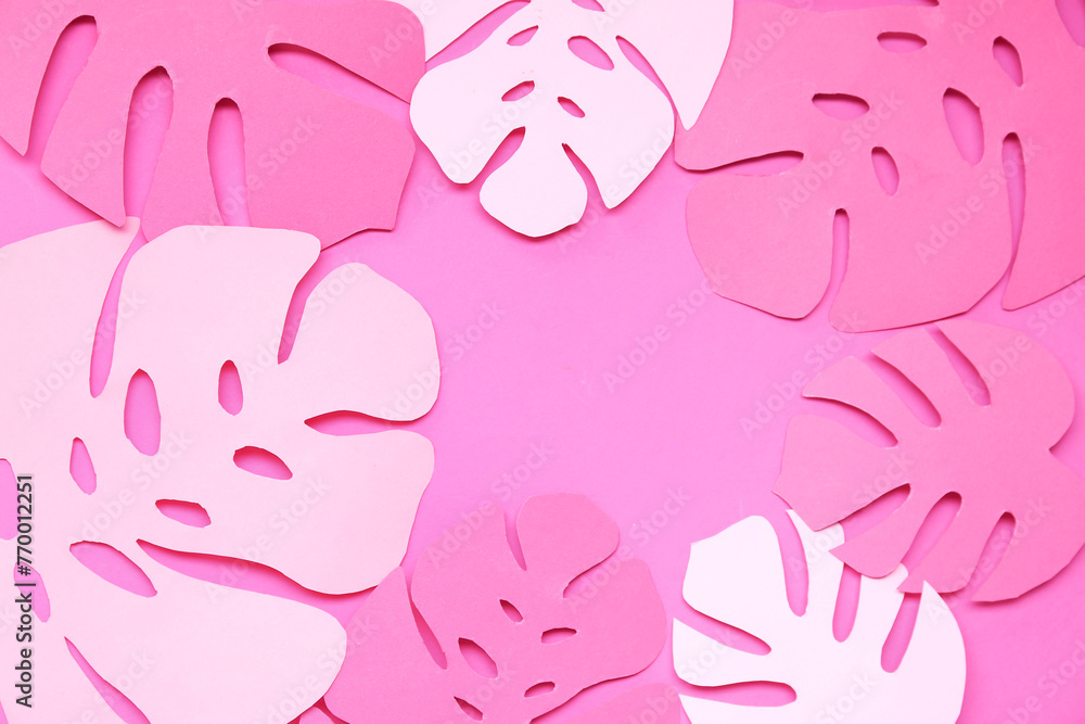 Composition with different paper leaves on pink background