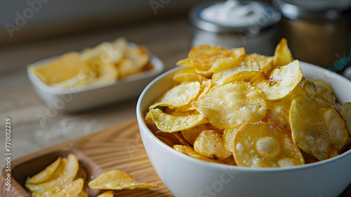 Crispy potato chips in a cup on a dark background, tinted