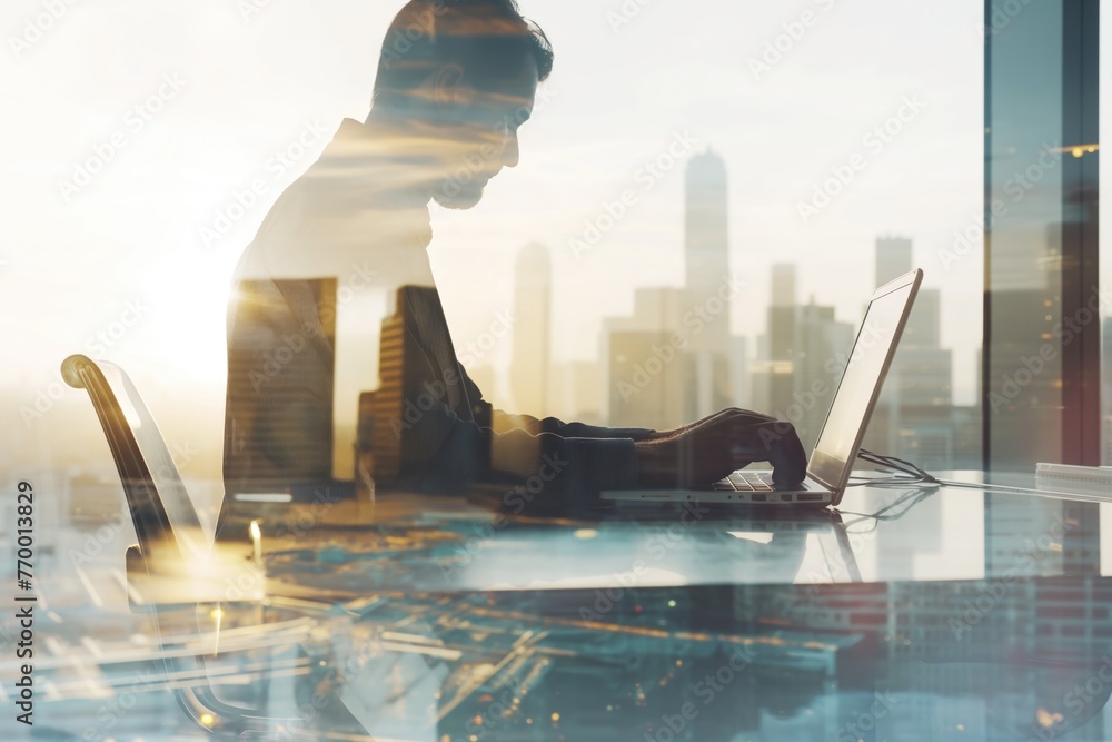 Naklejka premium Business man works in office with laptop in the foreground. Concept of teamwork and partnership. double exposure