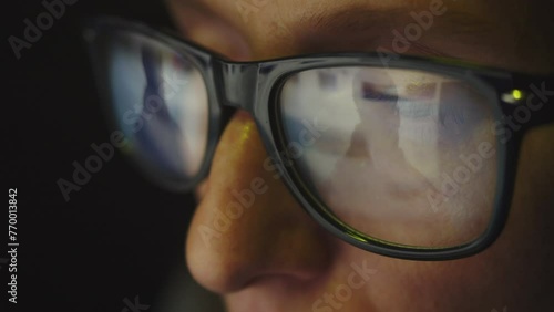 Wallpaper Mural In the reflection of glasses on a female face, surfing the Internet and a male silhouette. Cg footage Torontodigital.ca