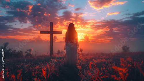 Woman from behind in front of old wooden cross