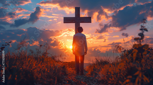 Man from behind in front of old wooden cross