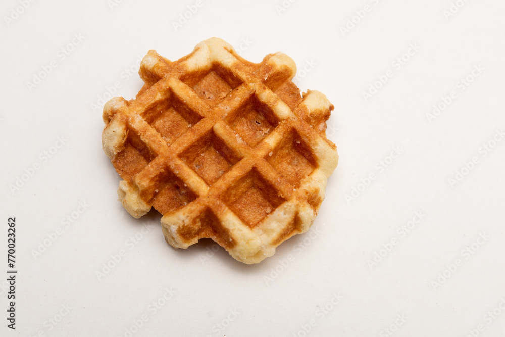 cookies on a white background,Belgian waffle isolated on white background, sugar waffles tasty dessert, appetizing and tasty cookies on a white background,Belgian waffle isolated on white background, sugar waffles tasty dessert, appetizing and tasty