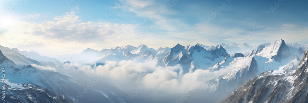 Top view of a mountain from an airplane. Breathtaking view through the clouds, illuminated by the soft light, natures grandeur. Inspiring view of snow-covered peak Top view of a mountain from an airplane. Breathtaking view through the clouds, illuminated by the soft light, natures grandeur. Inspiring view of snow-covered peak