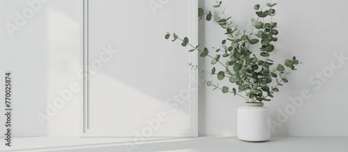 White-framed mockup featuring eucalyptus. Stylish mockup of a poster product design with a white frame. Elegantly designed empty frame mockup.