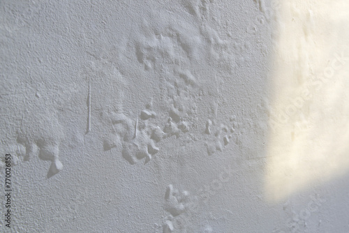 Saltpeter on the wall, Closeup of wall stained with water infiltration. Potassium nitrate, which is present in the building materials comes into contact with oxygen and creates excess moisture photo