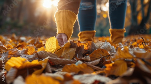 Person Walking Through Pile of Leaves