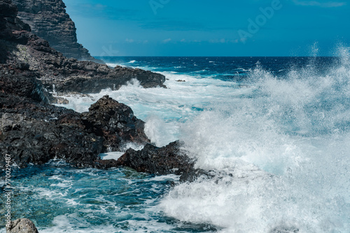 Makapuʻu Tide Pools, basalt comes from the Koʻolau volcano in eastern Oahu, Hawaii Geology. Waves hitting the rocks. 
