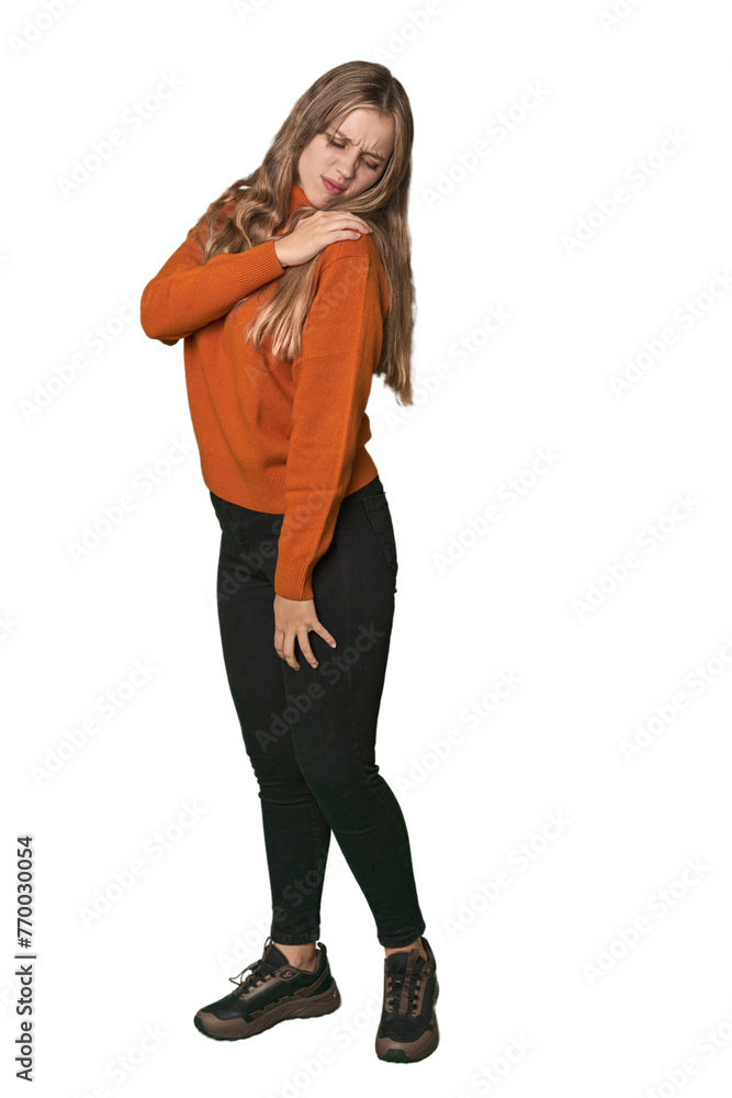 Studio portrait of a blonde Caucasian woman having a shoulder pain. Studio portrait of a blonde Caucasian woman having a shoulder pain.