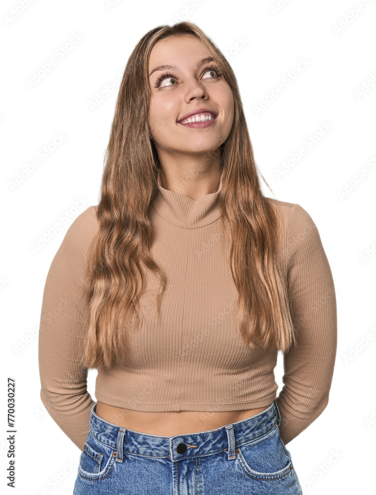 Studio portrait of a blonde Caucasian woman relaxed and happy laughing, neck stretched showing teeth. Studio portrait of a blonde Caucasian woman relaxed and happy laughing, neck stretched showing teeth.