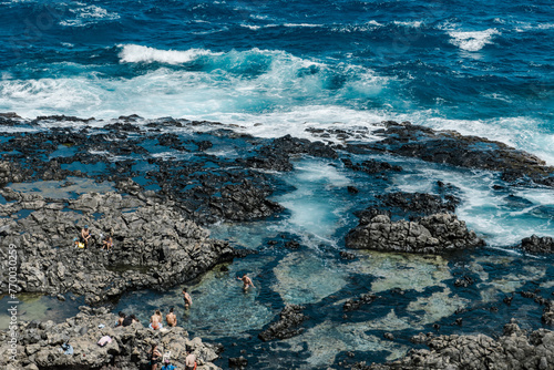 Makapuʻu Tide Pools, basalt comes from the Koʻolau volcano in eastern Oahu, Hawaii Geology. Waves hitting the rocks. 