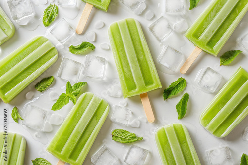 Green popsicles with mint leaves and ice on white. Generative AI image photo