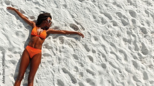 Woman in Orange Bikini Relaxing on Beach