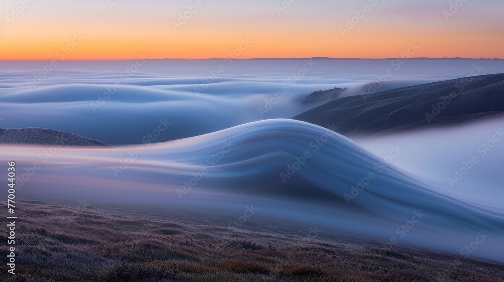 A sunset photo with a mountain range, clouds, and long exposure A sunset photo with a mountain range, clouds, and long exposure