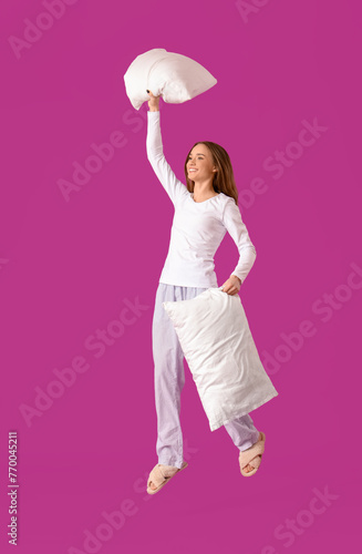 Young woman in pajamas with...