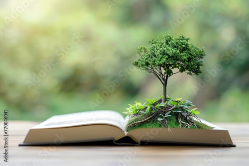 A book with green plants growing on it © ASDF