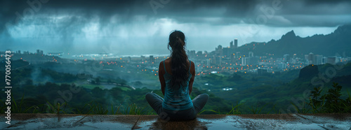 photo of the hawaiian mountain top overlooking cityscape, woman sitting in lotus position looking out at view,generative ai