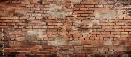 A detailed shot of a historic brown brick wall showcasing the intricate brickwork and rectangular stones. The building material and history can be seen in the aged font and wood