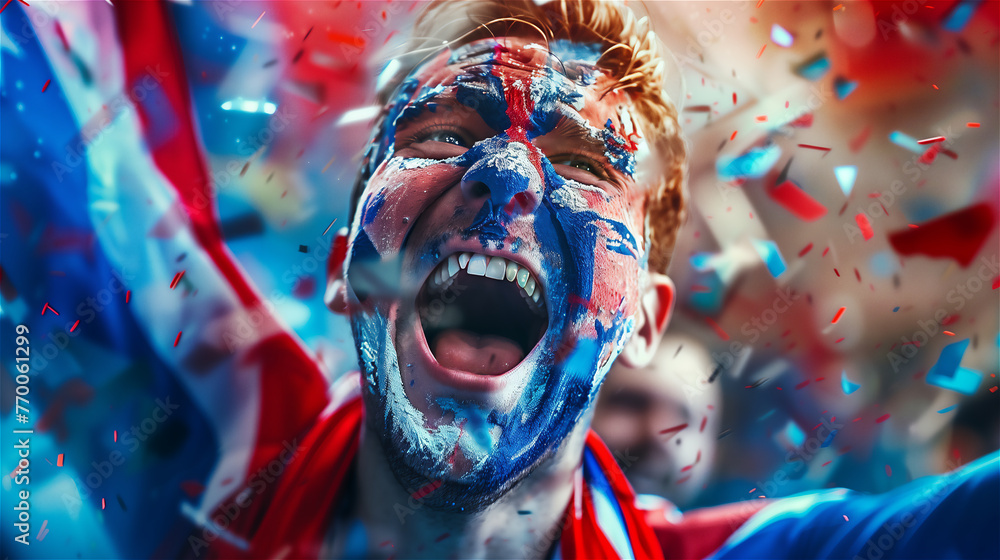 A cheerful fan of the national team with a cheering crowd in the background.