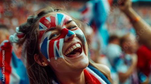 A cheerful fan of the national team with a cheering crowd in the background.