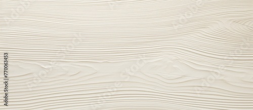 A detailed closeup of fluid beige wood grain texture, showcasing the intricate pattern of hardwood flooring with circular shapes