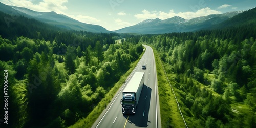 Aerial view of a truck driving on the road in the mountains