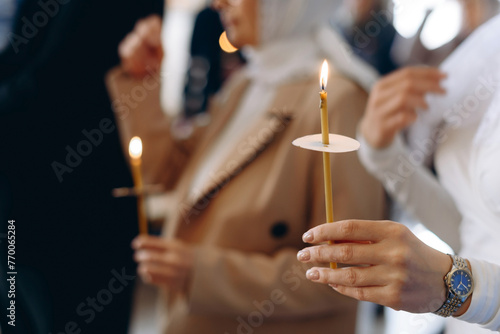 hand with church candle