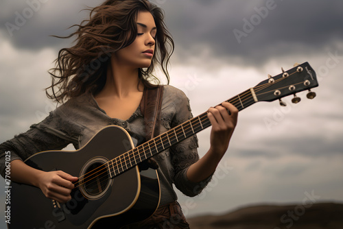 Dramatic Portrayal of a Female Guitarist Embracing Her Art Underneath a Gray Sky