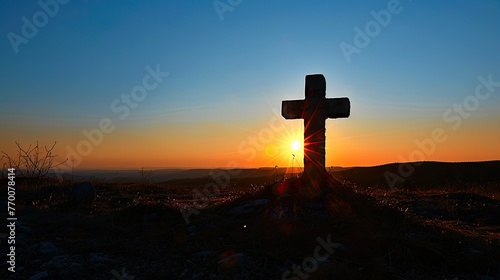 A powerful photograph of a cross silhouetted against a clear blue sky with the morning sun, conveying the significance of the cross in the Christian faith and the promise of redemption