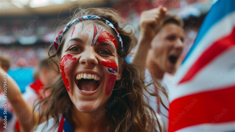 A cheerful fan of the national team with a cheering crowd in the background.