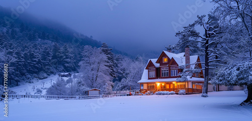 Early morning view of a Craftsman house with a snow-covered ski slope nearby