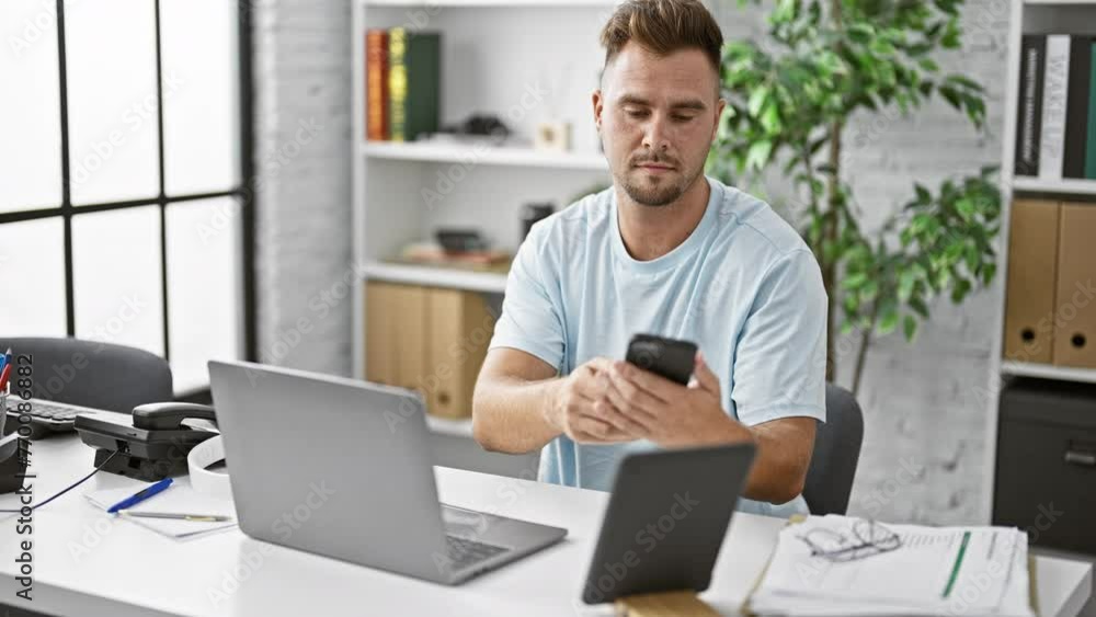 custom made wallpaper toronto digitalA young hispanic man with a beard uses technology in a modern office.