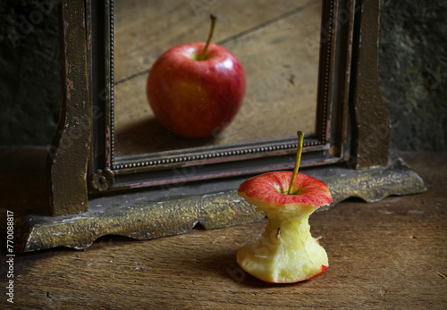 Obraz na plátne Surrealistic image with apple reflecting in the mirror.